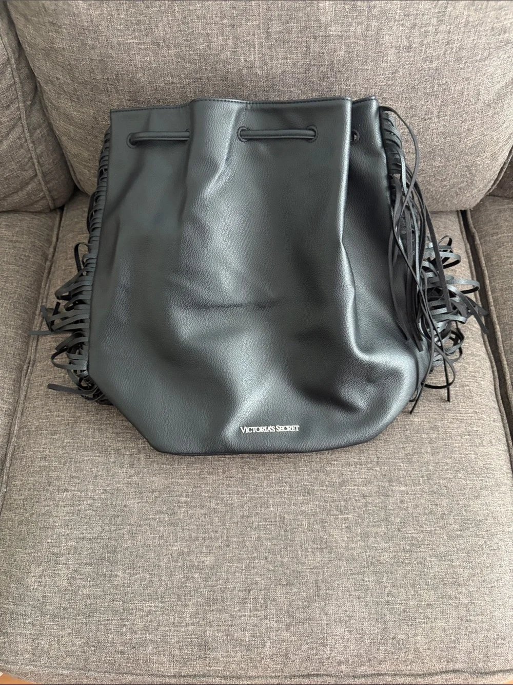 Victoria's Secret Black Fringe Drawstring backpack.